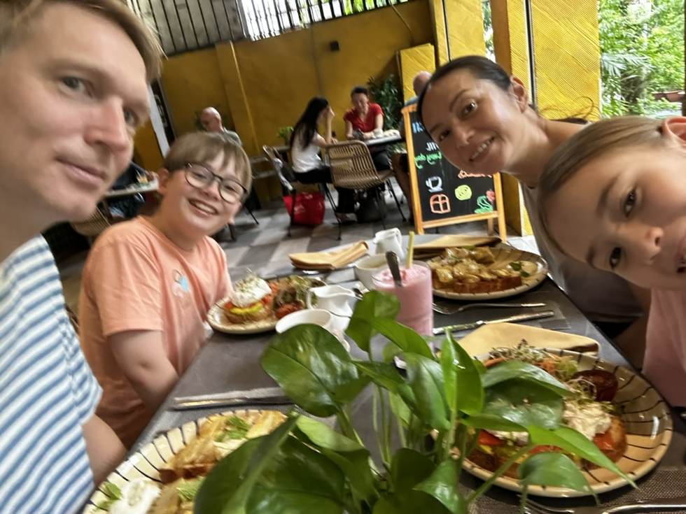 Daan with family in a Saigon café — the payoff of getting organised